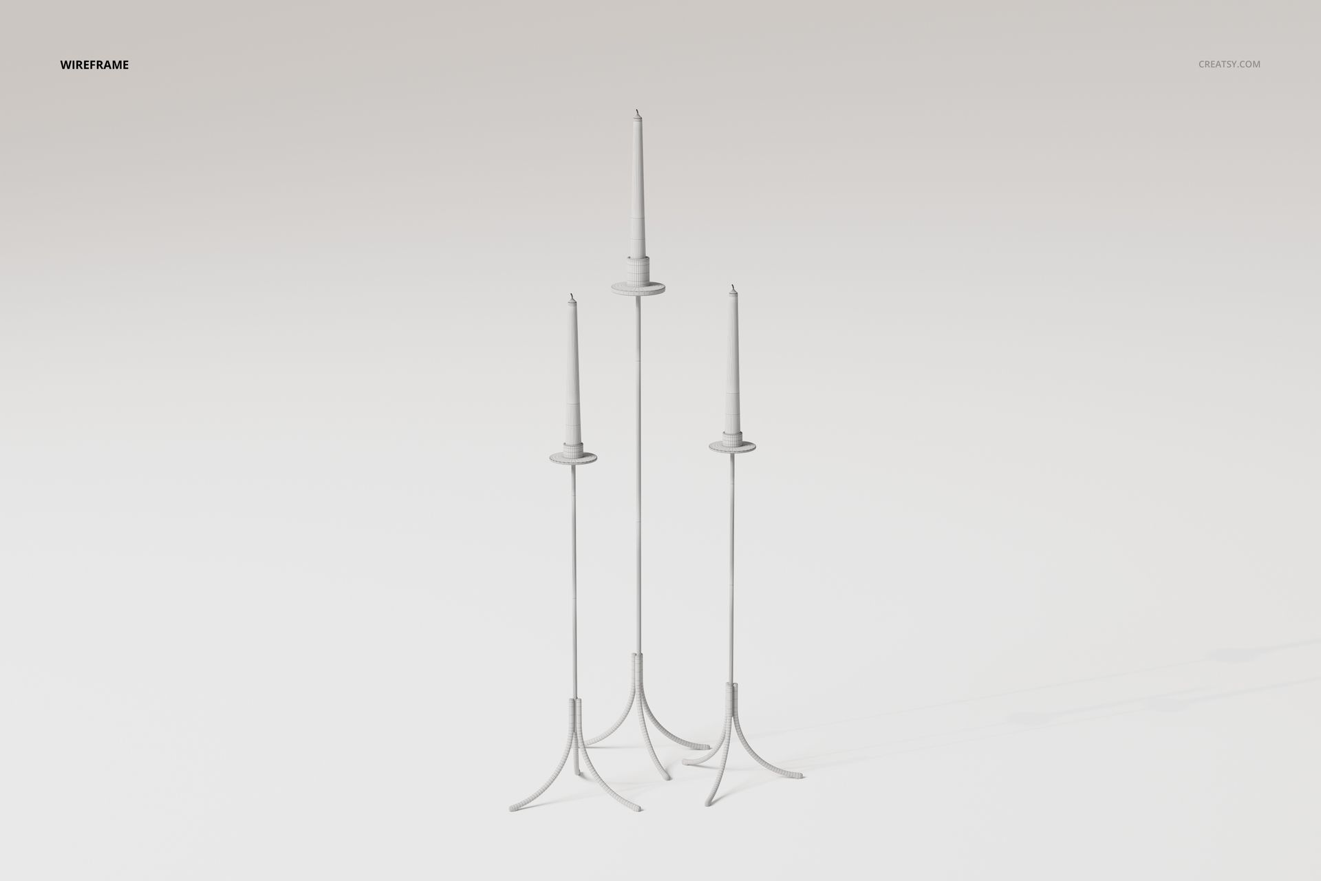 Three tall floor candle holders with thin stems and simple round bases, displayed on a plain white background.