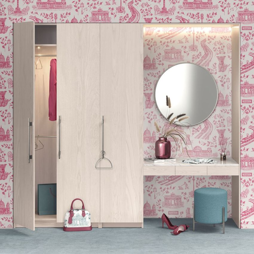 Wardrobe with vanity table mockup featuring light wood furniture, a round mirror, and pink patterned wallpaper in a home interior.