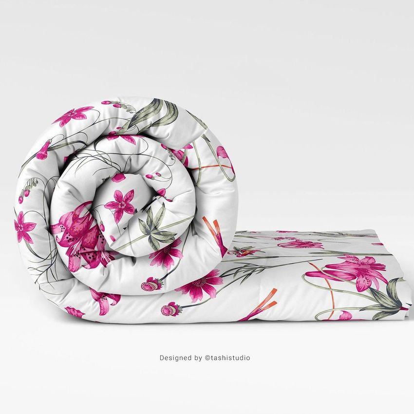 Microfiber comforter mockup featuring a rolled white comforter with pink floral pattern, displayed on a plain white background.