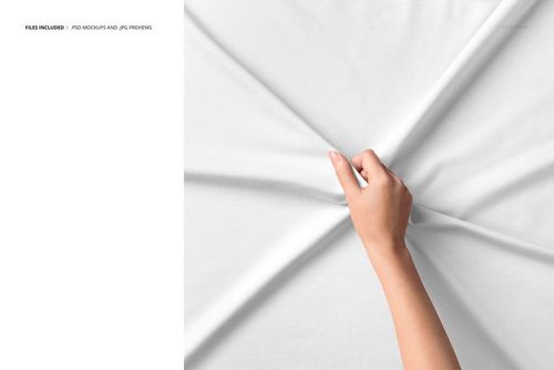 Mockup featuring a hand holding white jersey fabric, highlighting the textile's smooth surface and natural wrinkles.