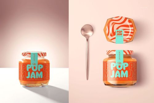 Jam jar mockup featuring a vibrant orange spread, bold patterned label, and a silver spoon on a light surface.