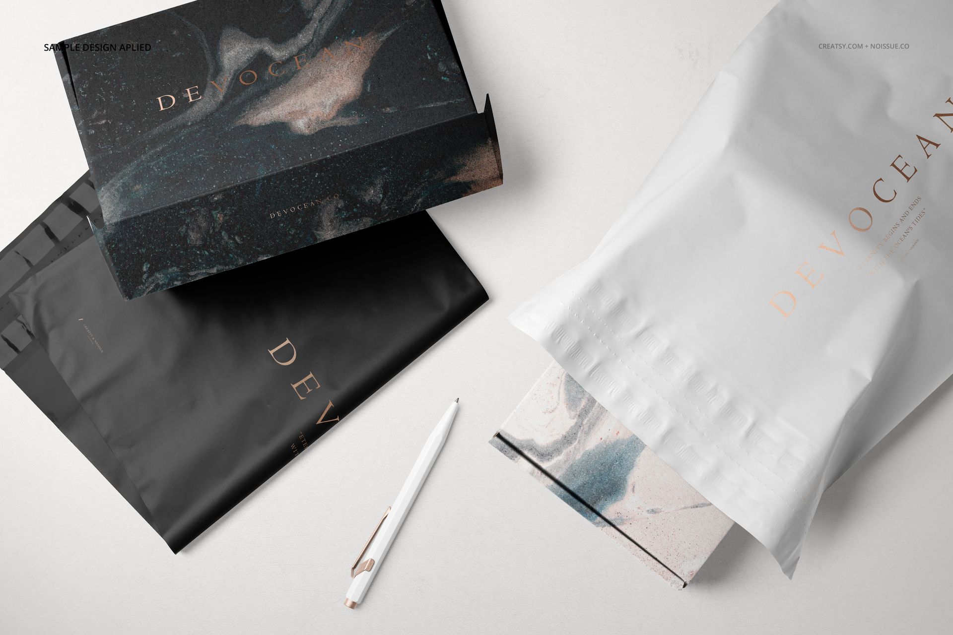 Top view of packaging mockup set featuring mailing boxes and poly mailers in black and white with marble designs.