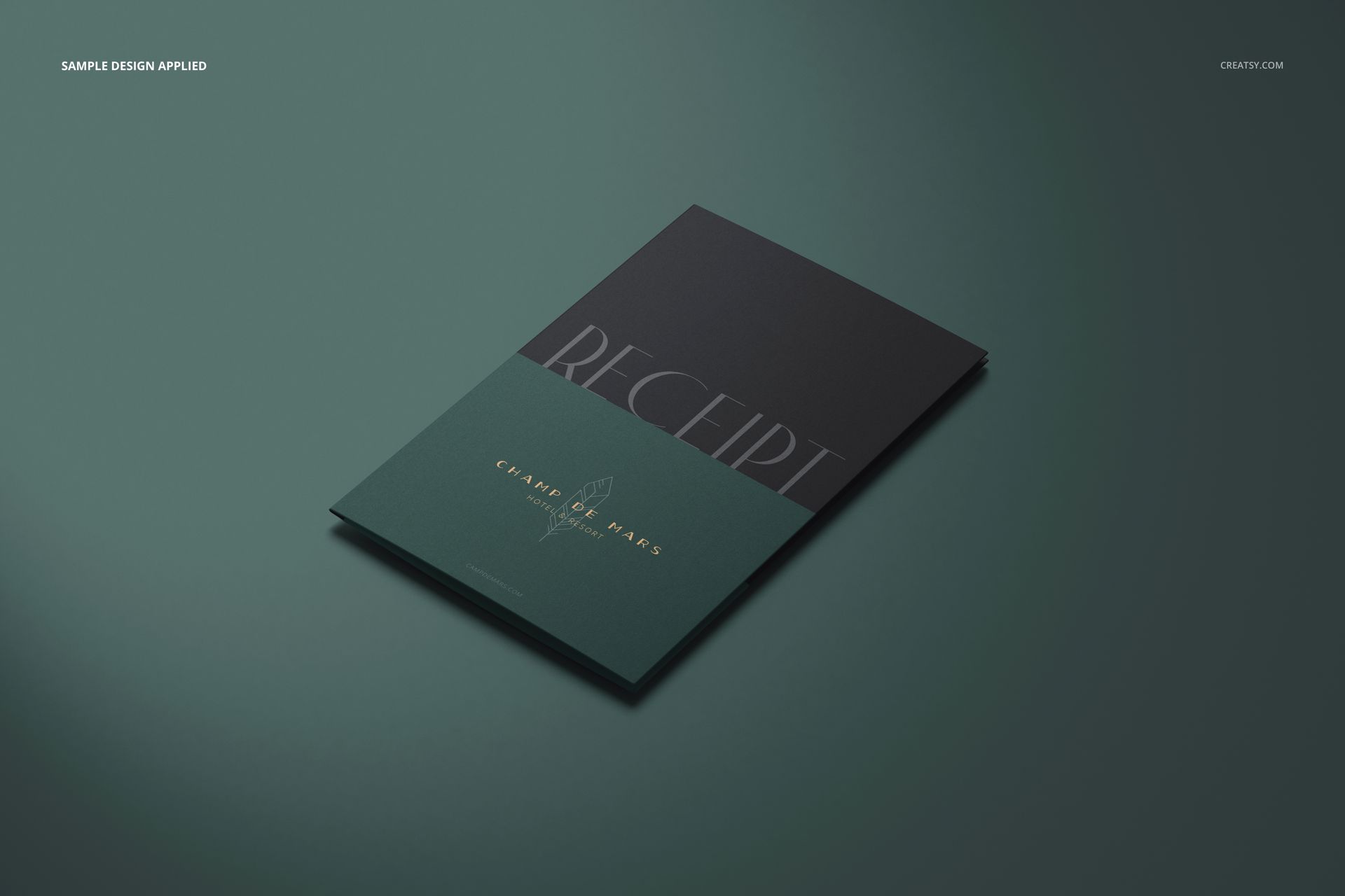 Front view of a receipt holder mockup with a two-tone dark green and black cover, placed on a green surface.