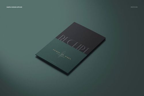 Front view of a receipt holder mockup with a two-tone dark green and black cover, placed on a green surface.