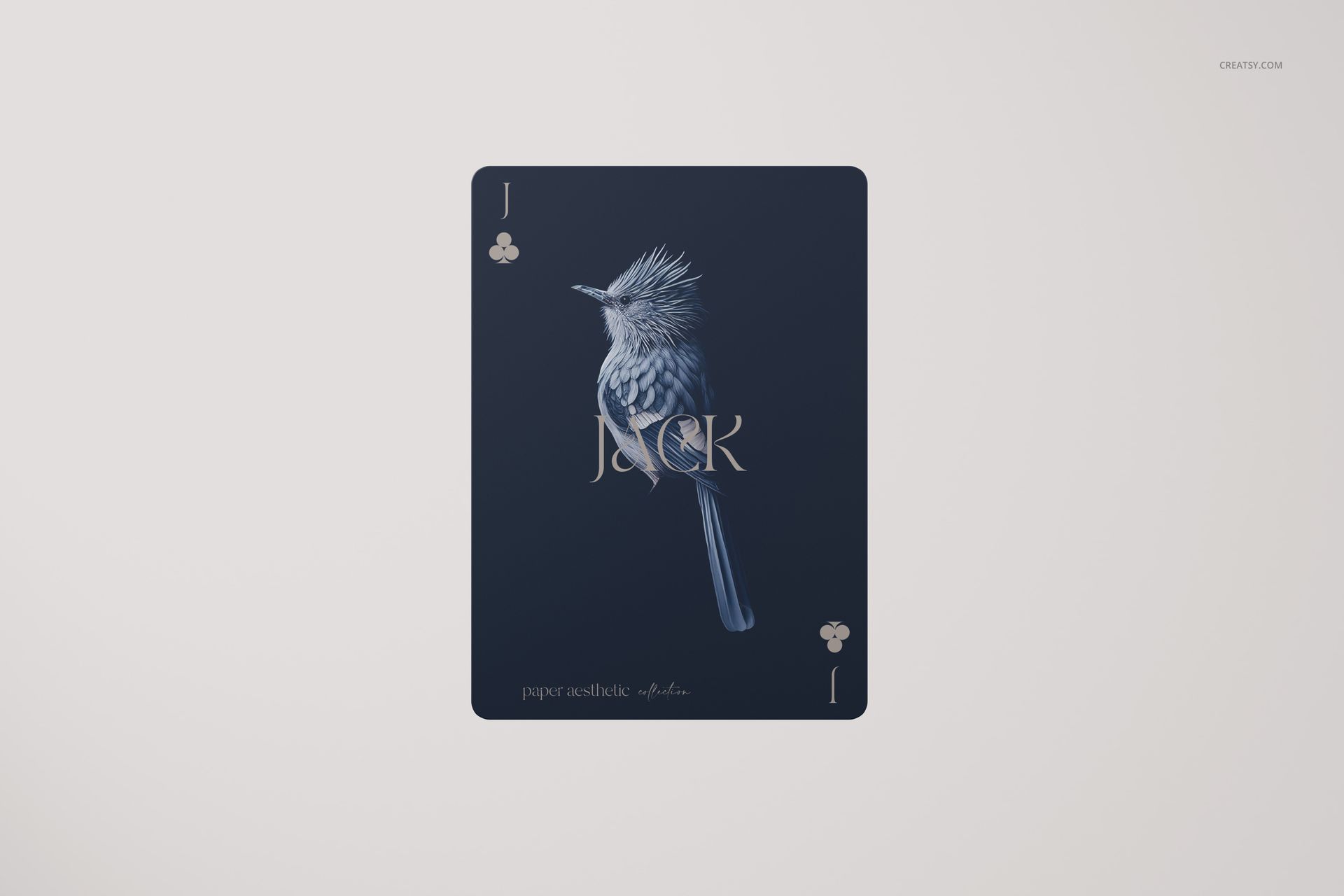 Single playing card mockup featuring a dark blue jack of clubs with a detailed bird illustration, front view on white background.