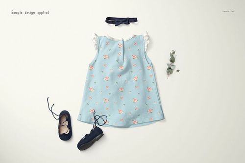 Baby dress mockup set showing a sleeveless blue dress with pink flowers, navy shoes, and a matching headband.
