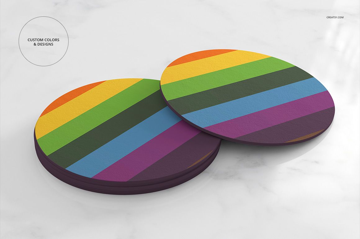 Colorful round coasters featuring horizontal rainbow stripes, arranged on a white marble background in a PSD mockup.