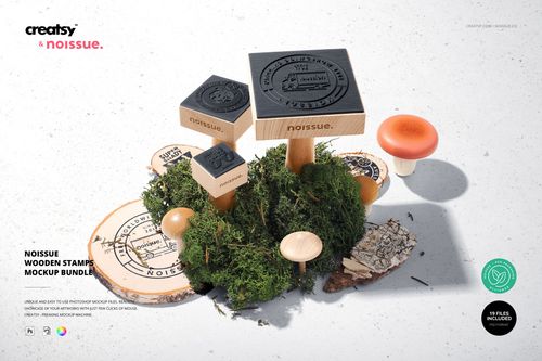 Front view of wooden stamps with black rubber tops arranged on moss and wood slices, part of a stationery mockup set.
