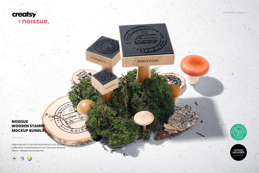 Front view of wooden stamps with black rubber tops arranged on moss and wood slices, part of a stationery mockup set.