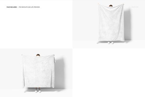 White fleece throw blanket held up by a person standing against a plain white wall, front view mockup scene.