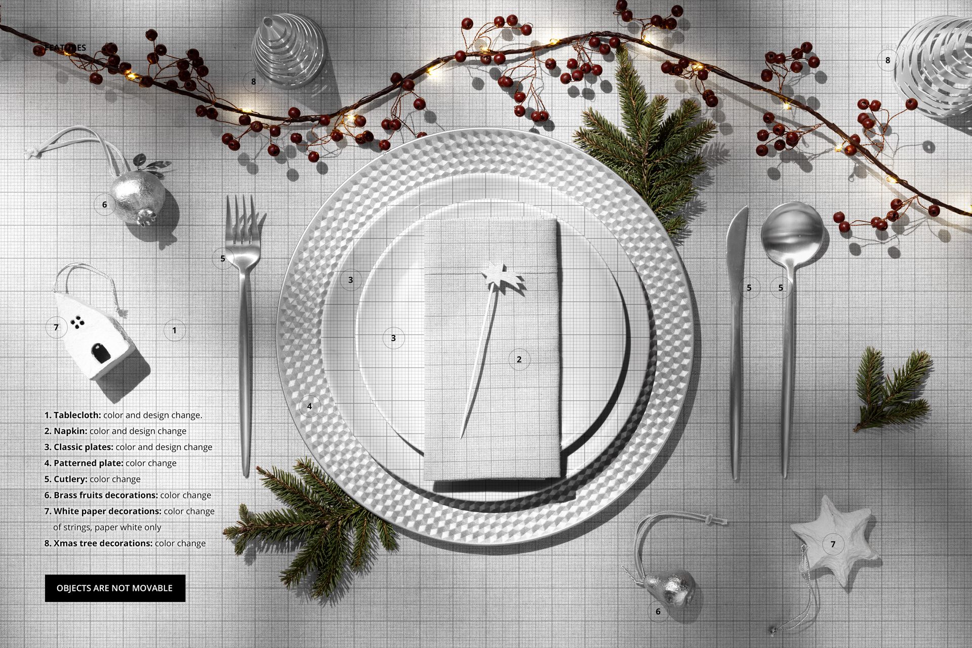 Christmas table setting mockup with patterned plates, silver cutlery, napkin, pine branches, and festive berries.