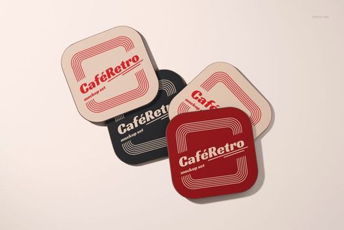 Top view of wooden base coaster mockup set featuring red, black, and beige coasters with vintage designs.