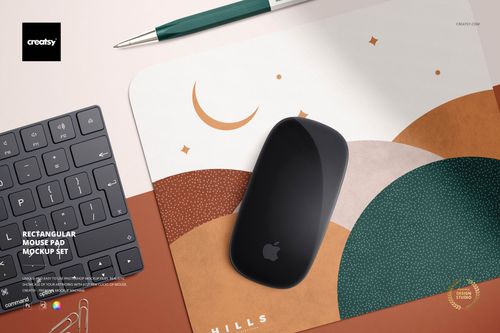 Angled perspective of a rectangular mouse pad mockup featuring curved shapes and muted colors, with a mouse and keyboard nearby.