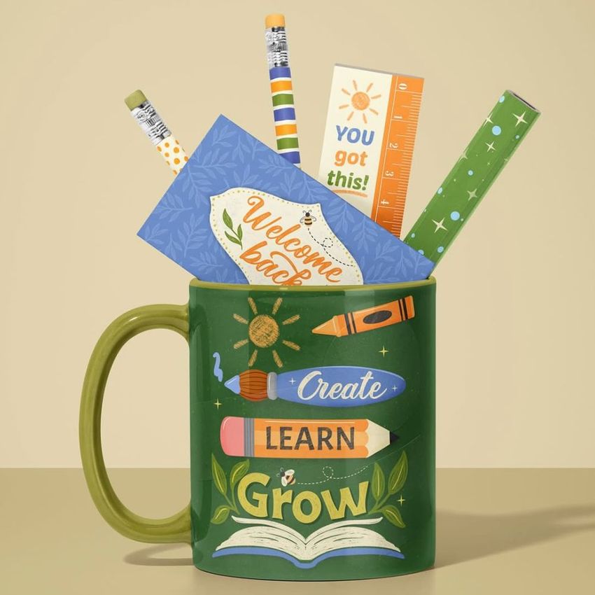 Mug mockup featuring a green ceramic mug with colorful stationery items like pencils, a ruler, and cards arranged inside.