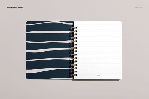 Top view of a small spiral notebook mockup, left side has abstract navy and white stripes, right side lined pages.