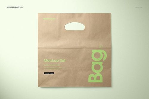 Front view of a die cut kraft paper bag mockup with a handle, featuring green text and minimal design on a light background.