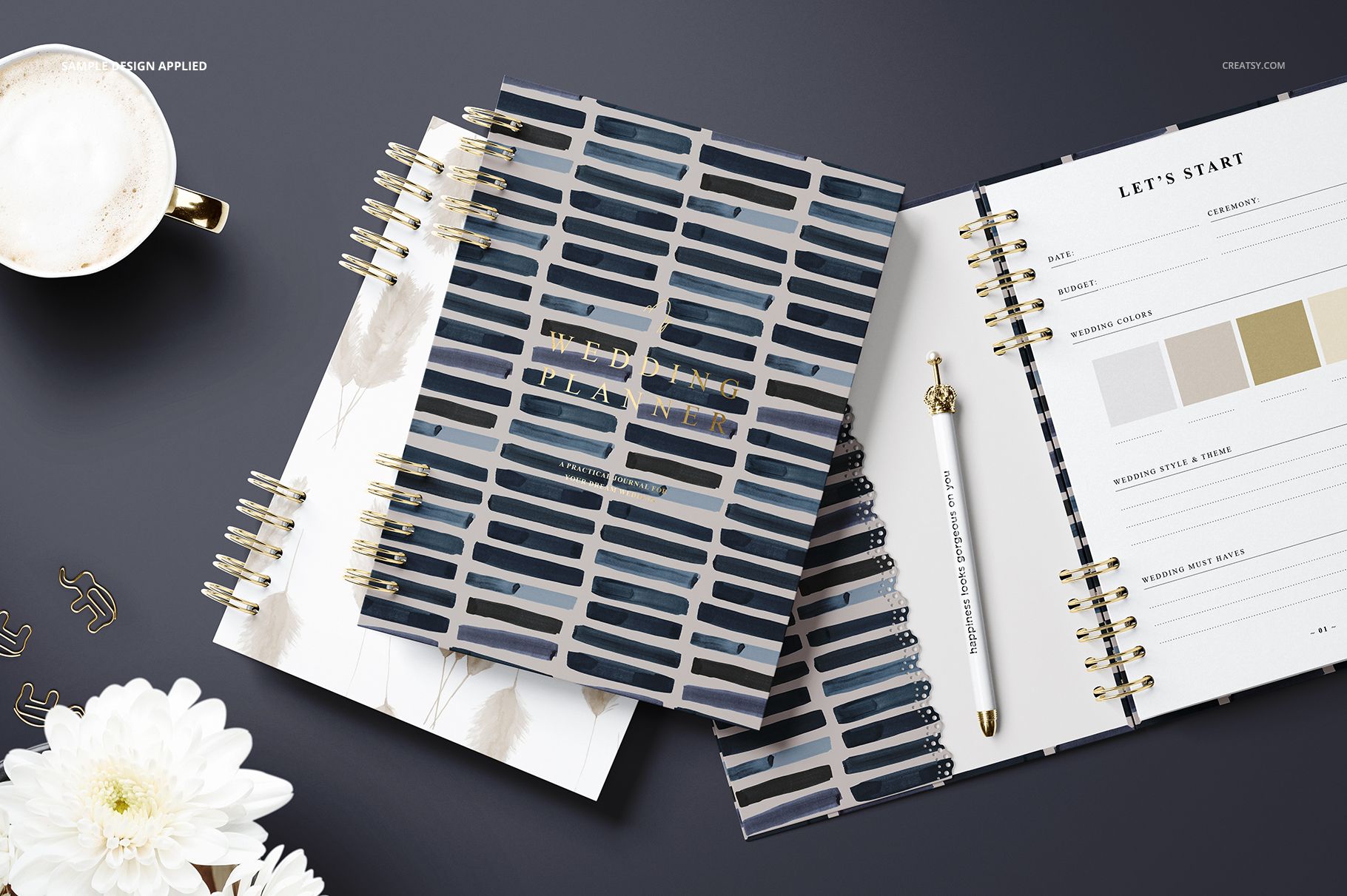 Spiral-bound planner mockup set displayed on a dark surface, featuring blue striped covers and open pages with a pen.