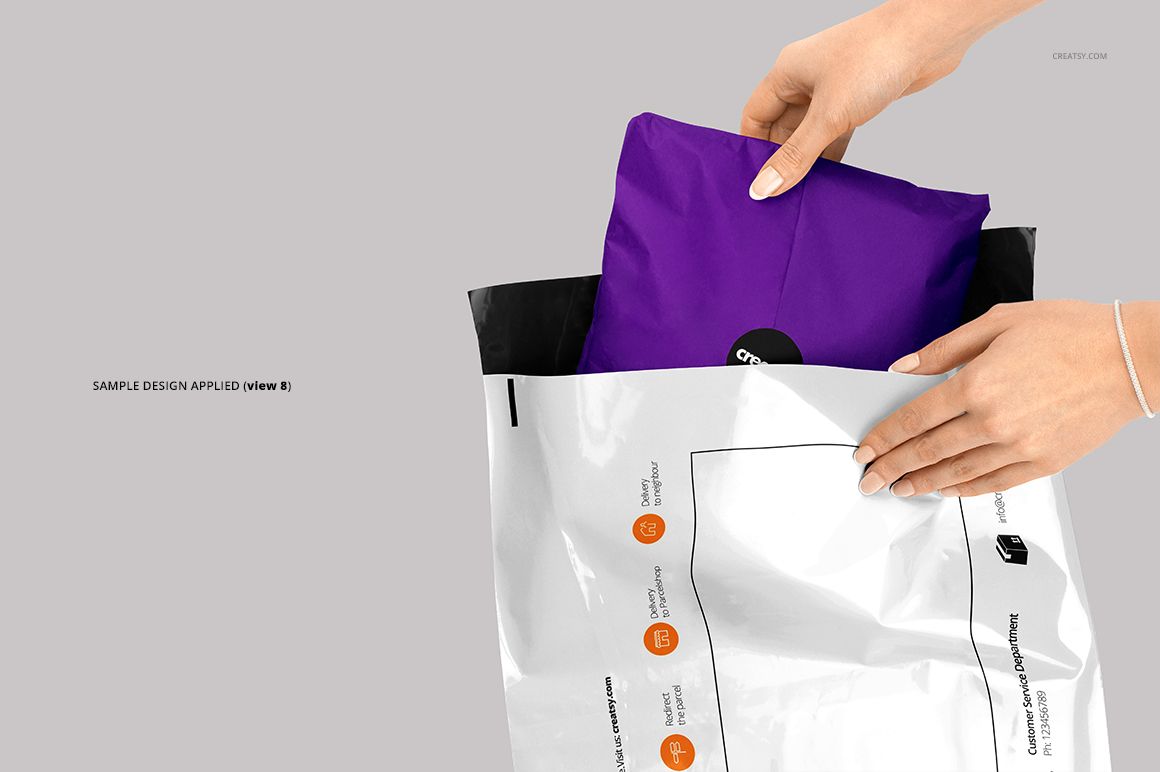 Front view of a white mailing bag mockup with black accents, being filled with a purple item, set against a neutral backdrop.