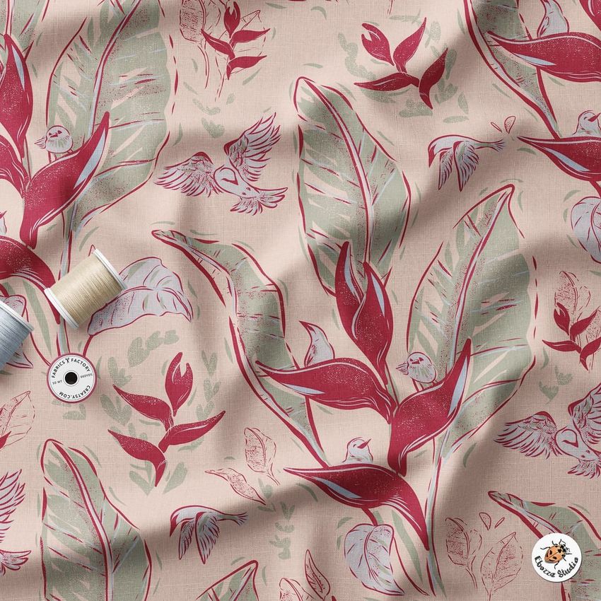 Wrinkled fabric mockup featuring a botanical pattern with red heliconia flowers, green leaves, and small birds on a beige background.