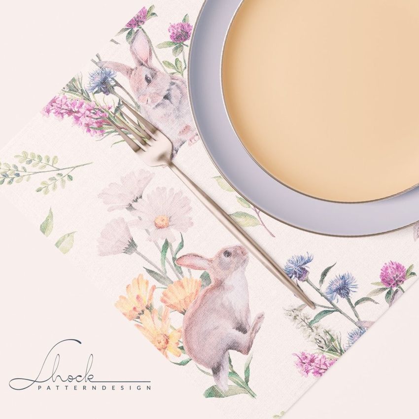 Placemat napkin plate mockup showing a pastel plate and fork on a floral placemat with watercolor rabbits and flowers.