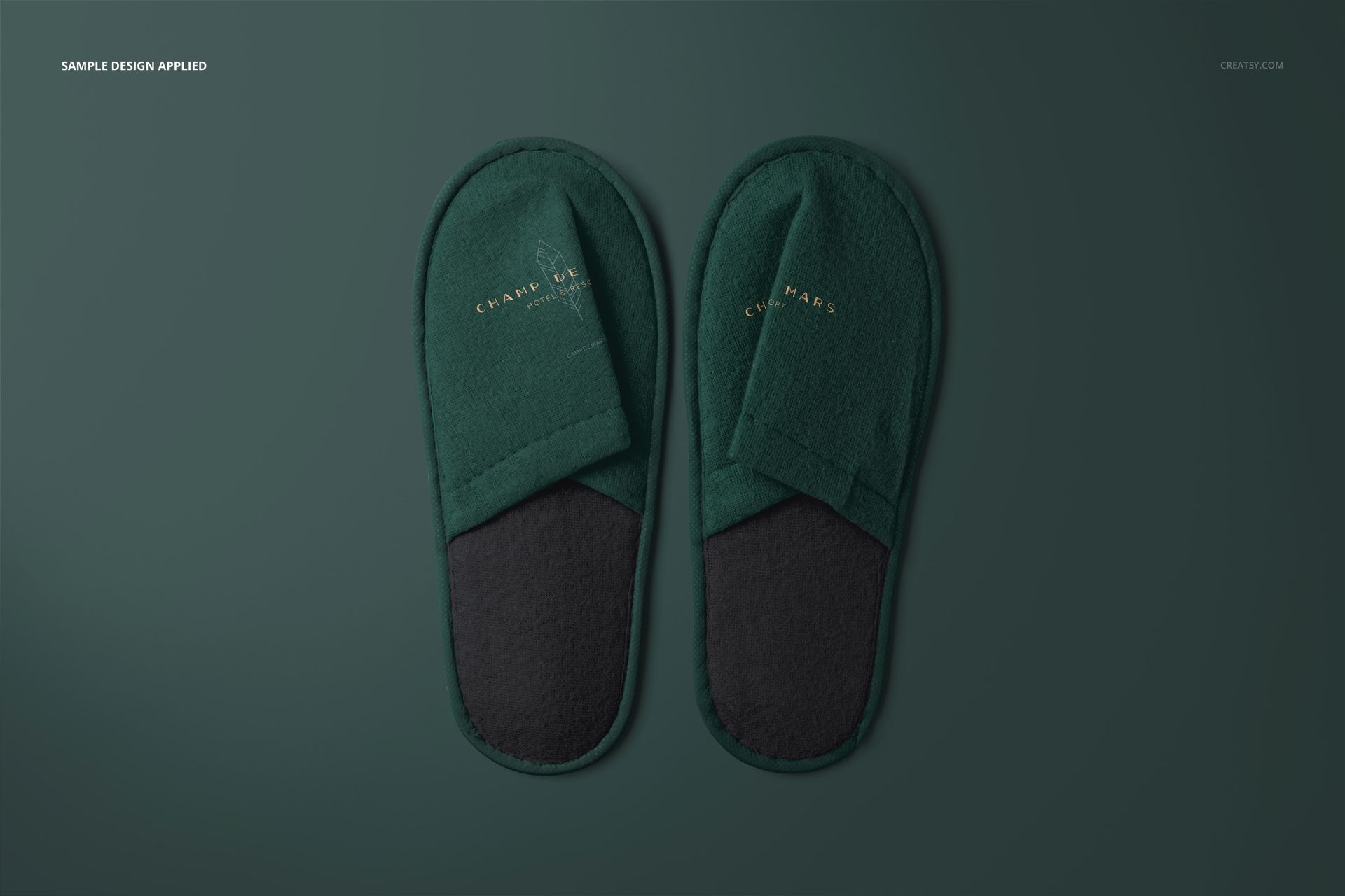 Mockup of hotel slippers set, showing both slippers side by side in green and black tones against a green backdrop.