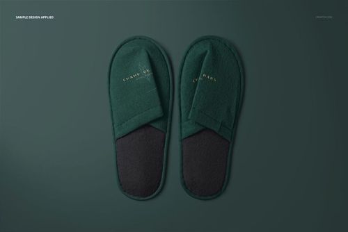 Mockup of hotel slippers set, showing both slippers side by side in green and black tones against a green backdrop.