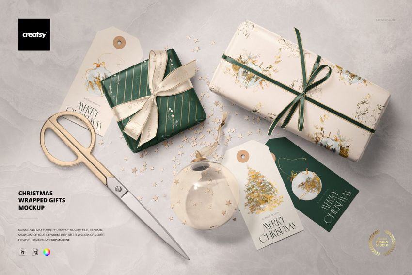Christmas PSD mockup featuring two wrapped presents, three customizable gift tags, scissors, and a transparent ornament with star-shaped confetti.