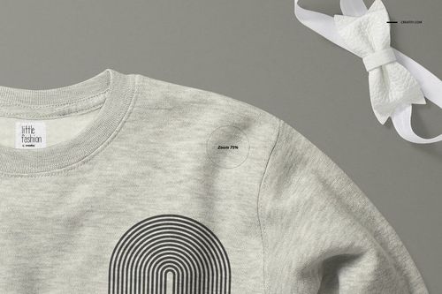 Heather gray baby sweatshirt mockup shown from a top angle, featuring a black geometric print and a white bow nearby.