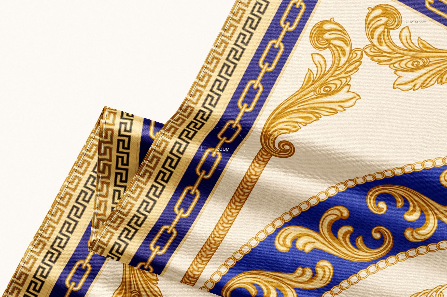 Elegant satin scarf mockup featuring intricate gold chains and scrolls on blue and cream, displayed in a folded view.