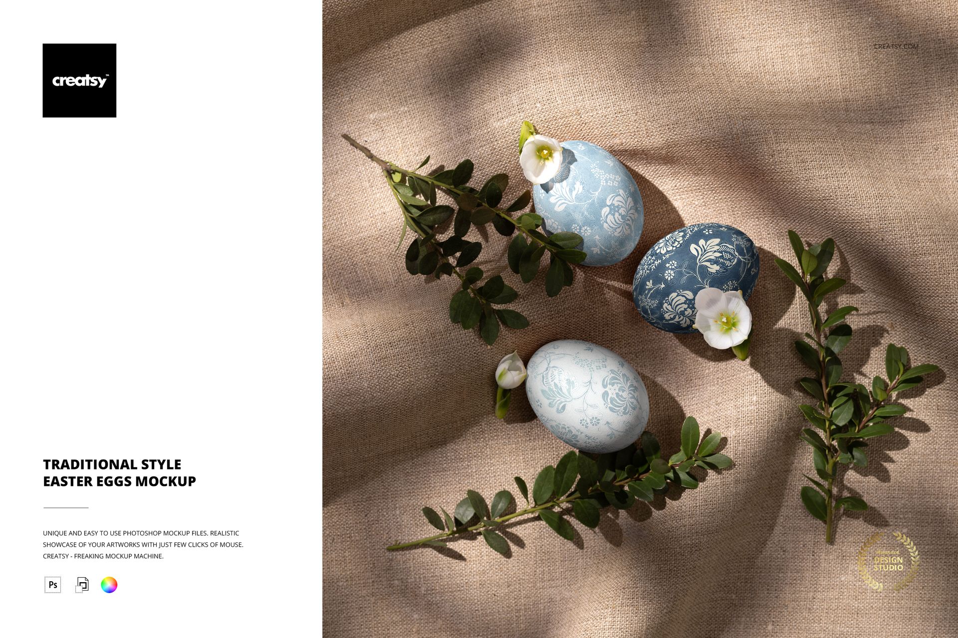 Three traditional style Easter eggs with blue and white floral patterns on linen fabric, surrounded by boxwood branches and white flowers, top view mockup.