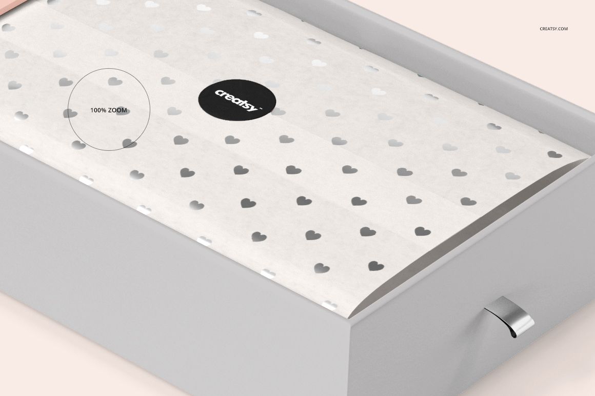 Rectangular gift box mockup with white tissue paper featuring a repeating gray heart pattern, shown from a top angle.