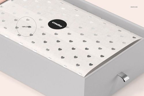 Rectangular gift box mockup with white tissue paper featuring a repeating gray heart pattern, shown from a top angle.
