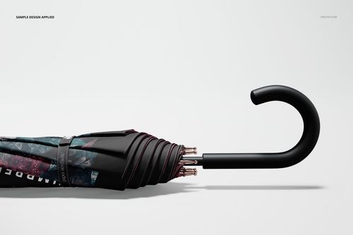 Closed umbrella mockup with a black curved handle, featuring a dark floral pattern, shown from a side view.