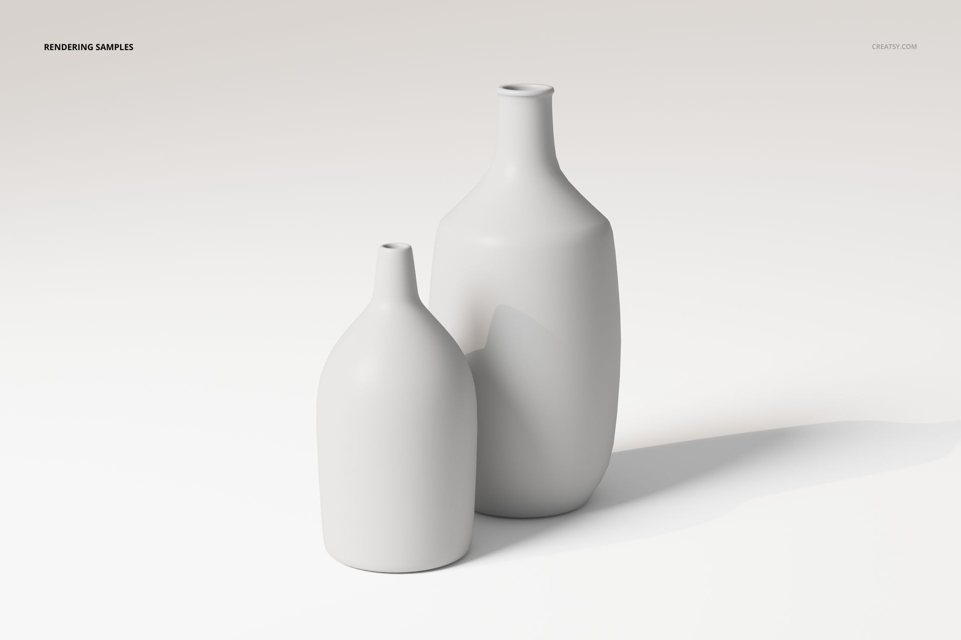 Front view of two decorative ceramic flower vases in matte white finish, placed on a light neutral surface.