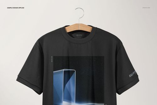 Black oversized t-shirt mockup displayed on a hanger, with a modern geometric design printed on the front.