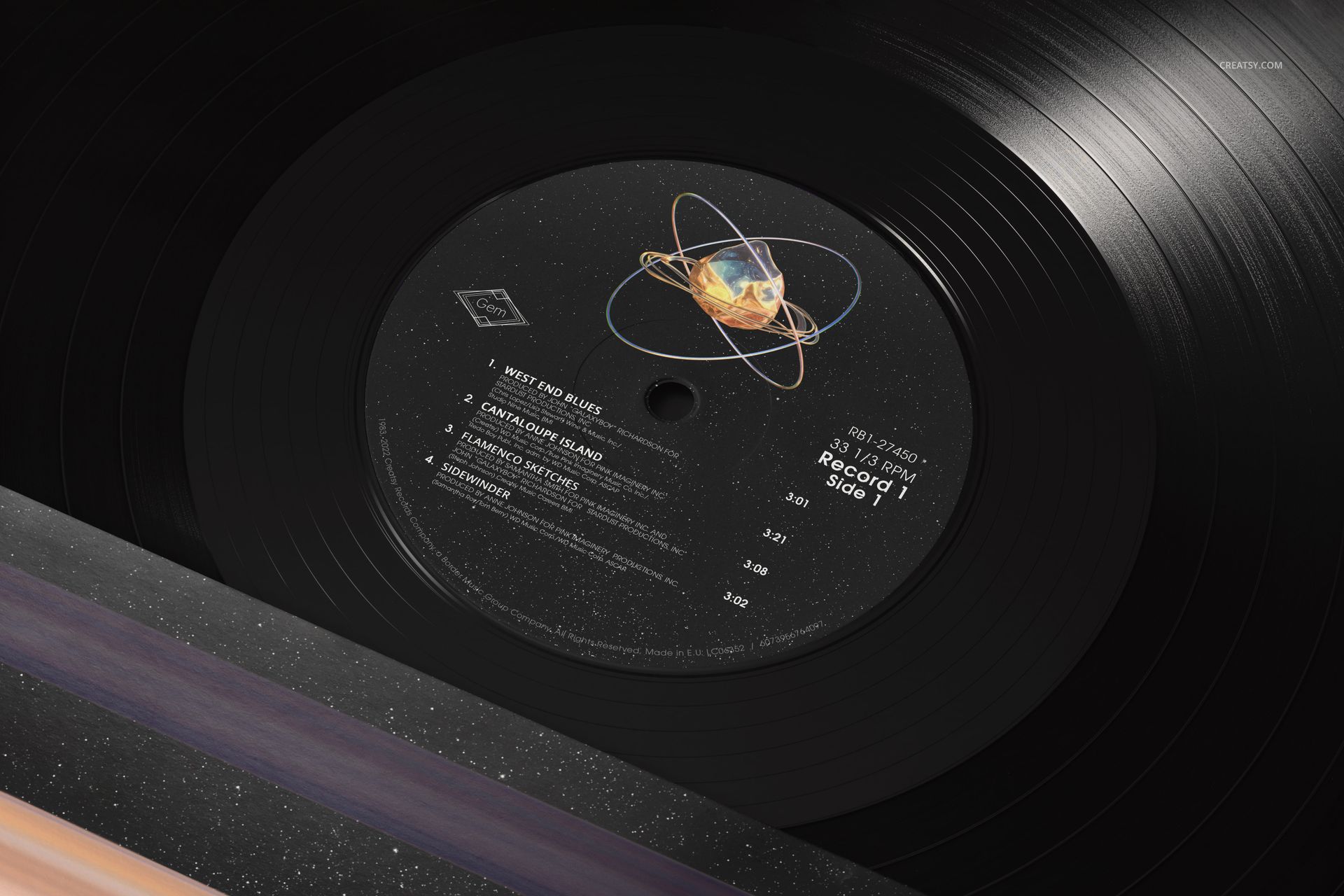 Close-up view of a black vinyl record mockup with a colorful label, highlighting the shiny texture and circular grooves.