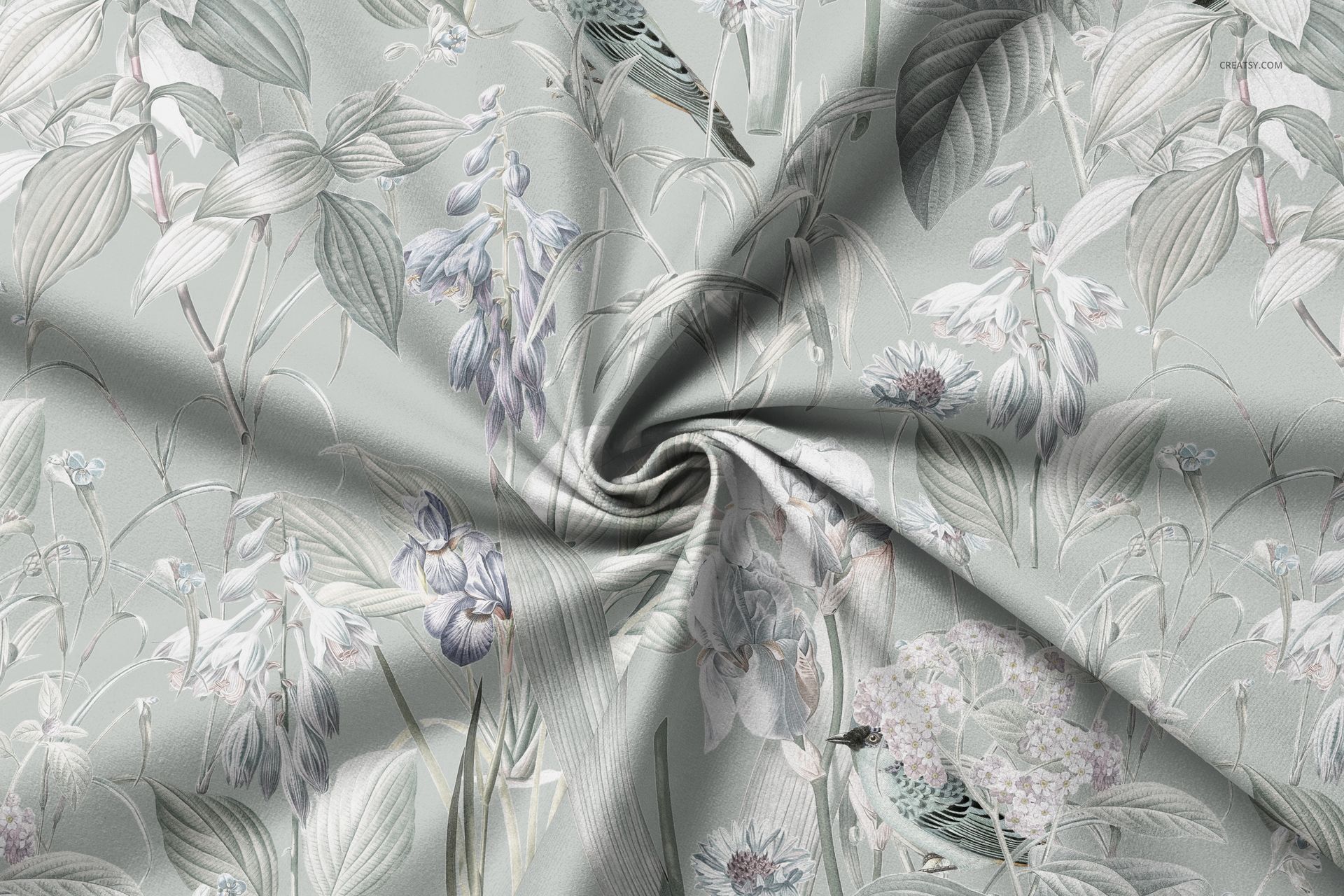 Curtain fabric mockup with a soft floral pattern in muted green and lavender tones, shown in a twisted arrangement.