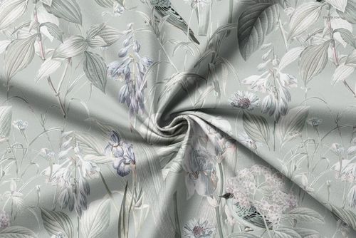 Curtain fabric mockup with a soft floral pattern in muted green and lavender tones, shown in a twisted arrangement.