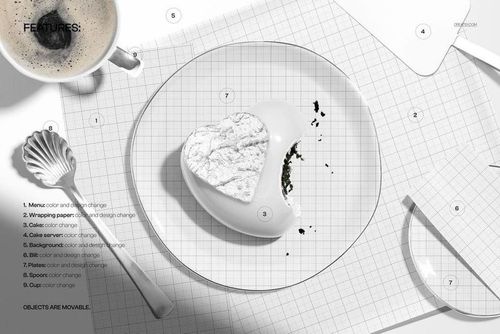 Top view of a heart shaped mousse cake with a marbled white surface, placed on a plate next to a coffee cup and menu mockup.