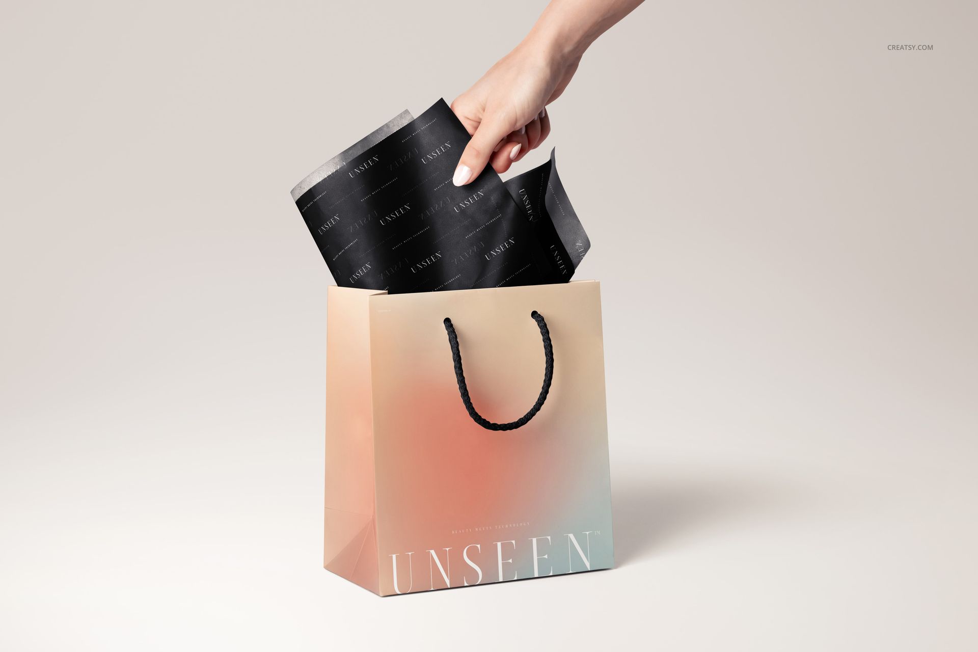 Mockup showing a close-up of a gift bag with gradient colors and black tissue paper, set against a light backdrop.