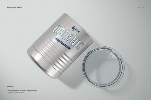 Front view of a vacuum insulated tumbler mockup in silver with engraved details and a detached transparent lid.