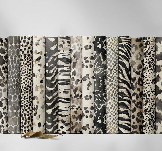 Folded fabrics mockup featuring multiple fabric pieces with various animal print patterns arranged vertically on a neutral surface.