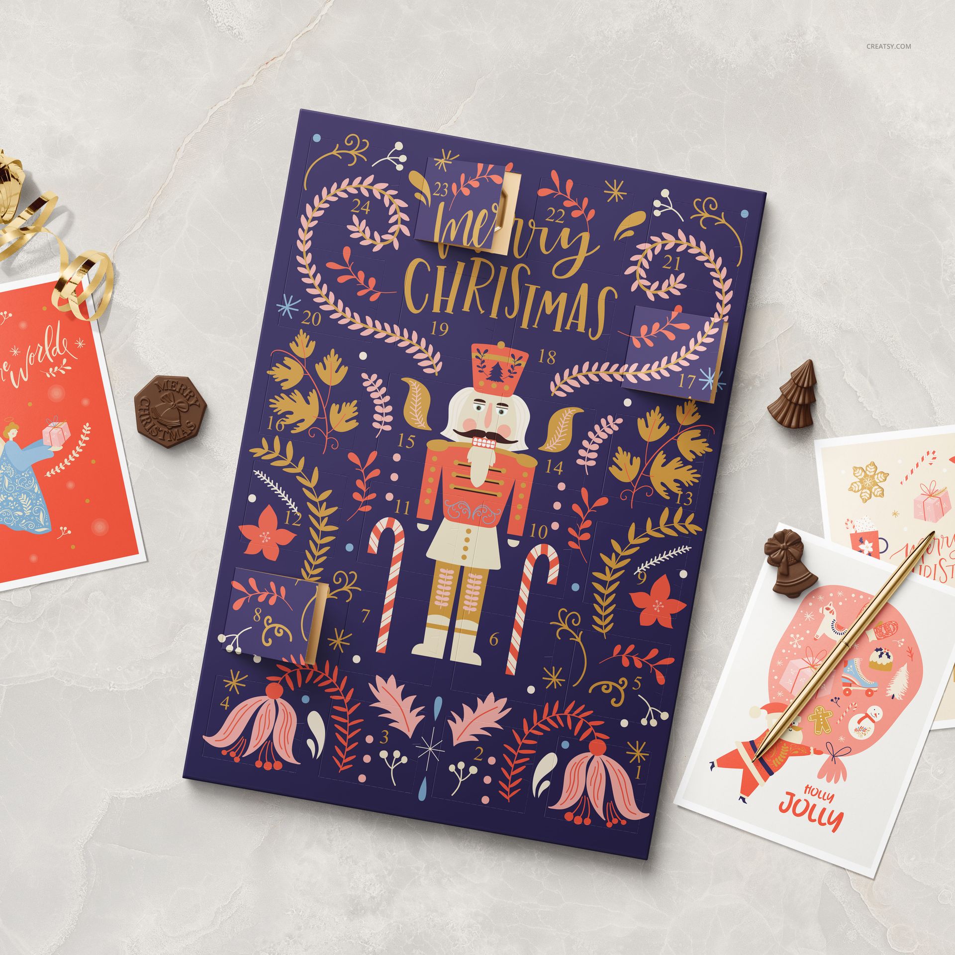 Paper advent calendar mockup featuring a nutcracker, candy canes, and floral patterns, styled with chocolates and cards.