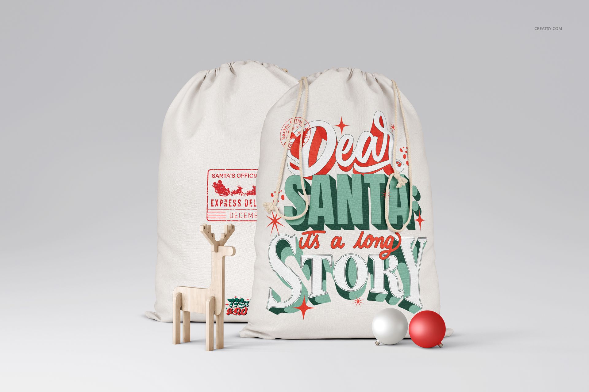 Christmas sack PSD mockup set displaying two fabric bags with colorful seasonal designs, staged with festive props.