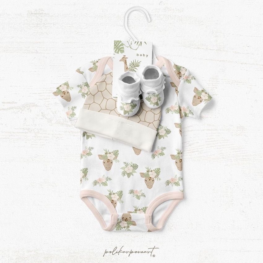 Baby onesie mockup with a tropical animal pattern, matching hat and booties, displayed on a white textured background.
