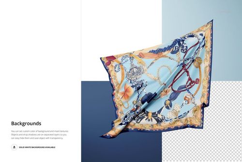 Silk scarf with ornate chain and floral pattern floating against a split blue and white background in a mockup scene.