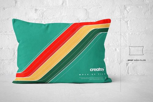 Queen size pillow mockup featuring bold diagonal stripes in red, yellow, and green, displayed on a white brick wall.