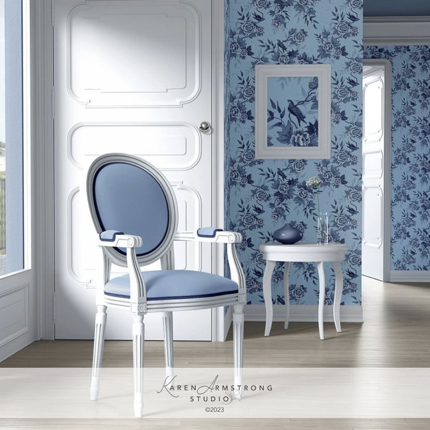 Living room mockup featuring a medallion back armchair with blue upholstery, set against blue floral wallpaper and a white door.