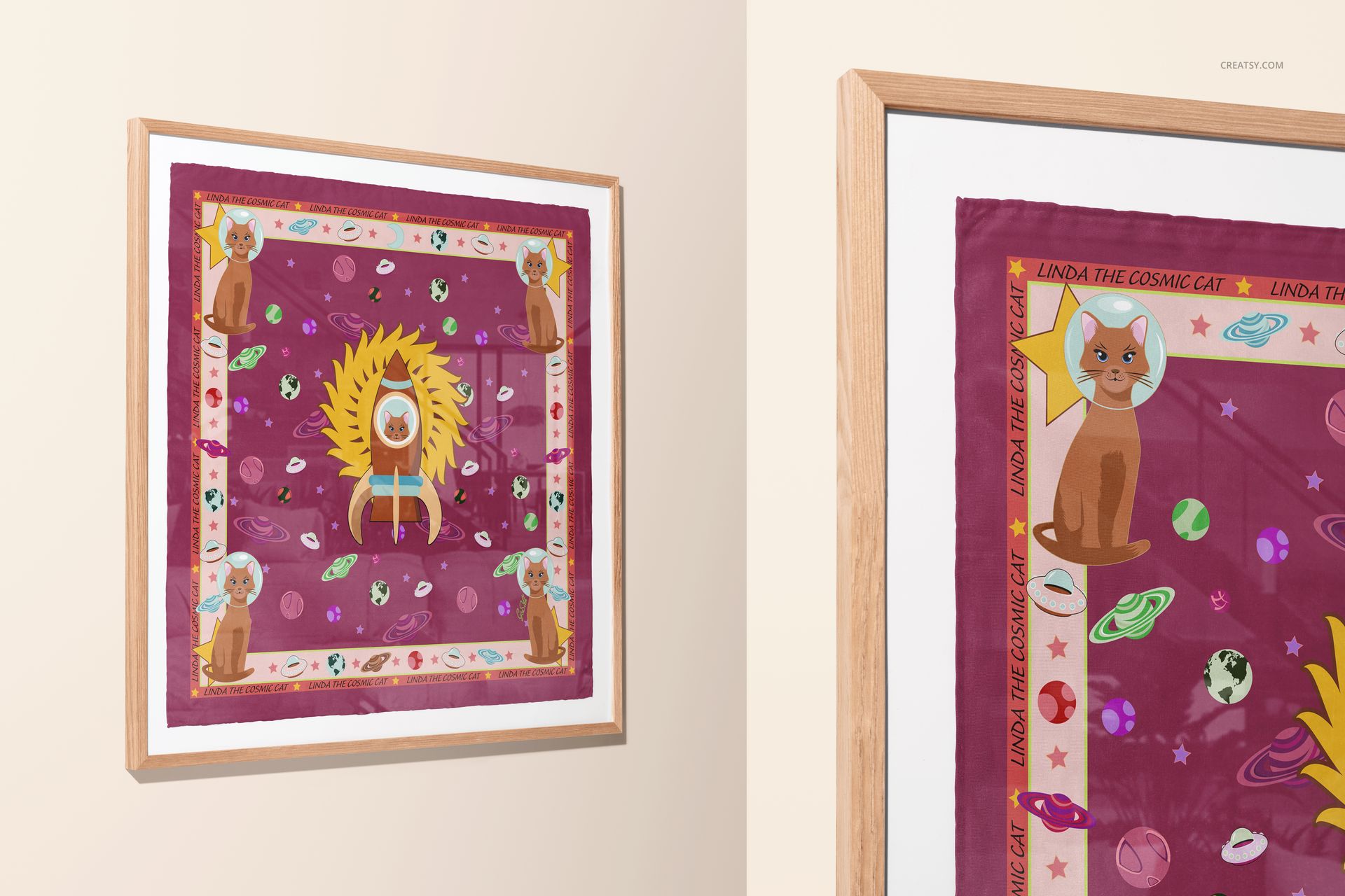 Square silk scarf featuring playful cat and space-themed designs, presented as a framed wall art mockup, angled perspective.