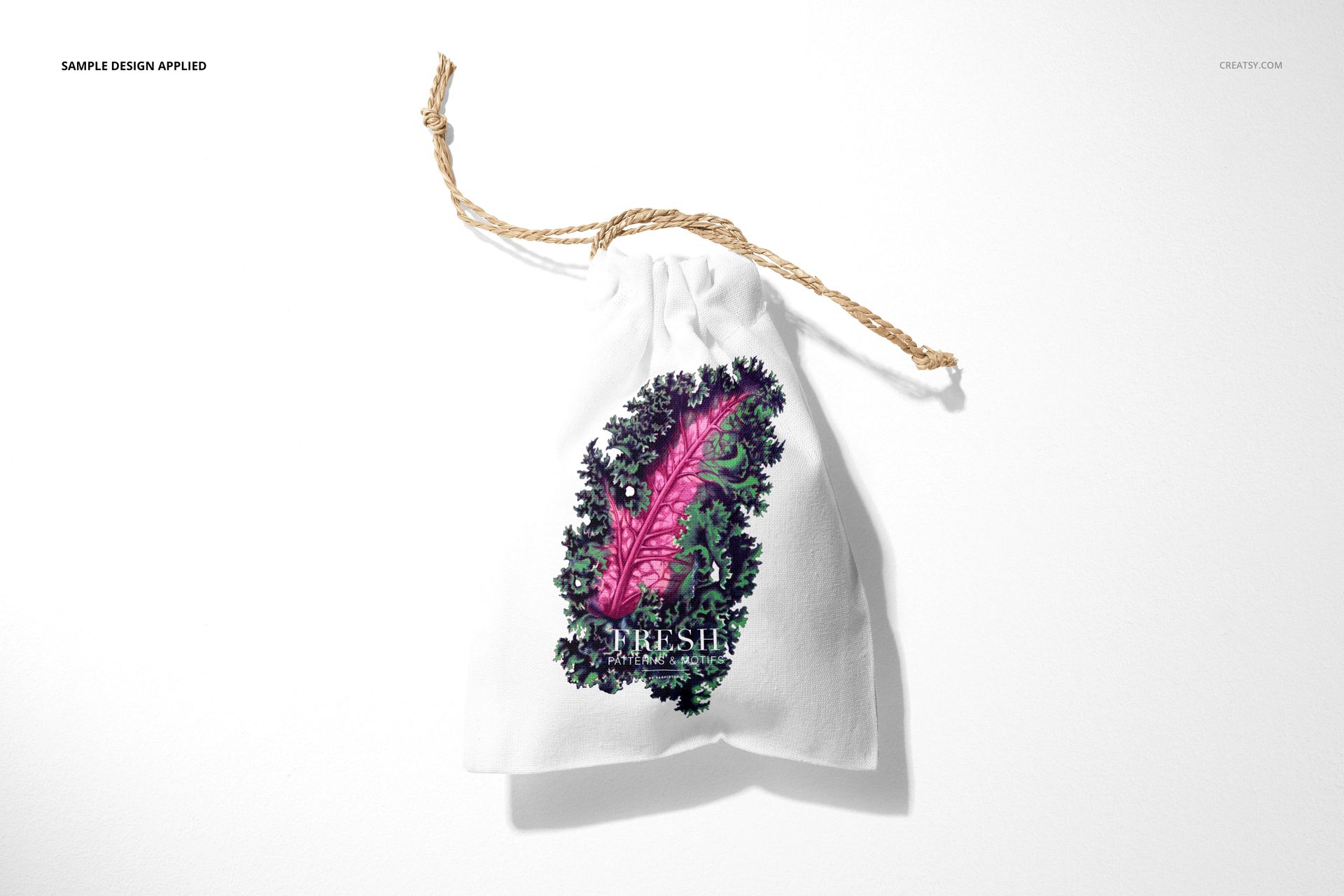 Linen pouch mockup featuring a drawstring closure and vibrant botanical artwork, shown from above on a plain surface.